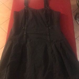 A black Tripp bucket overalls dress